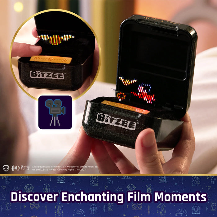 Hand holding a black electronic device with 'BITZEE' branding, showing a digital display.