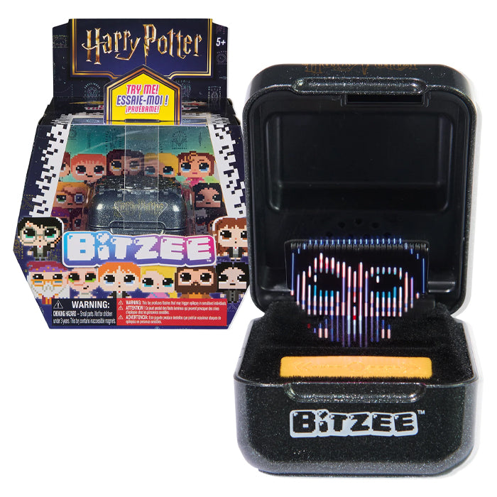 Bitzee toy with open packaging showing electronic component, Harry Potter branded box in the background