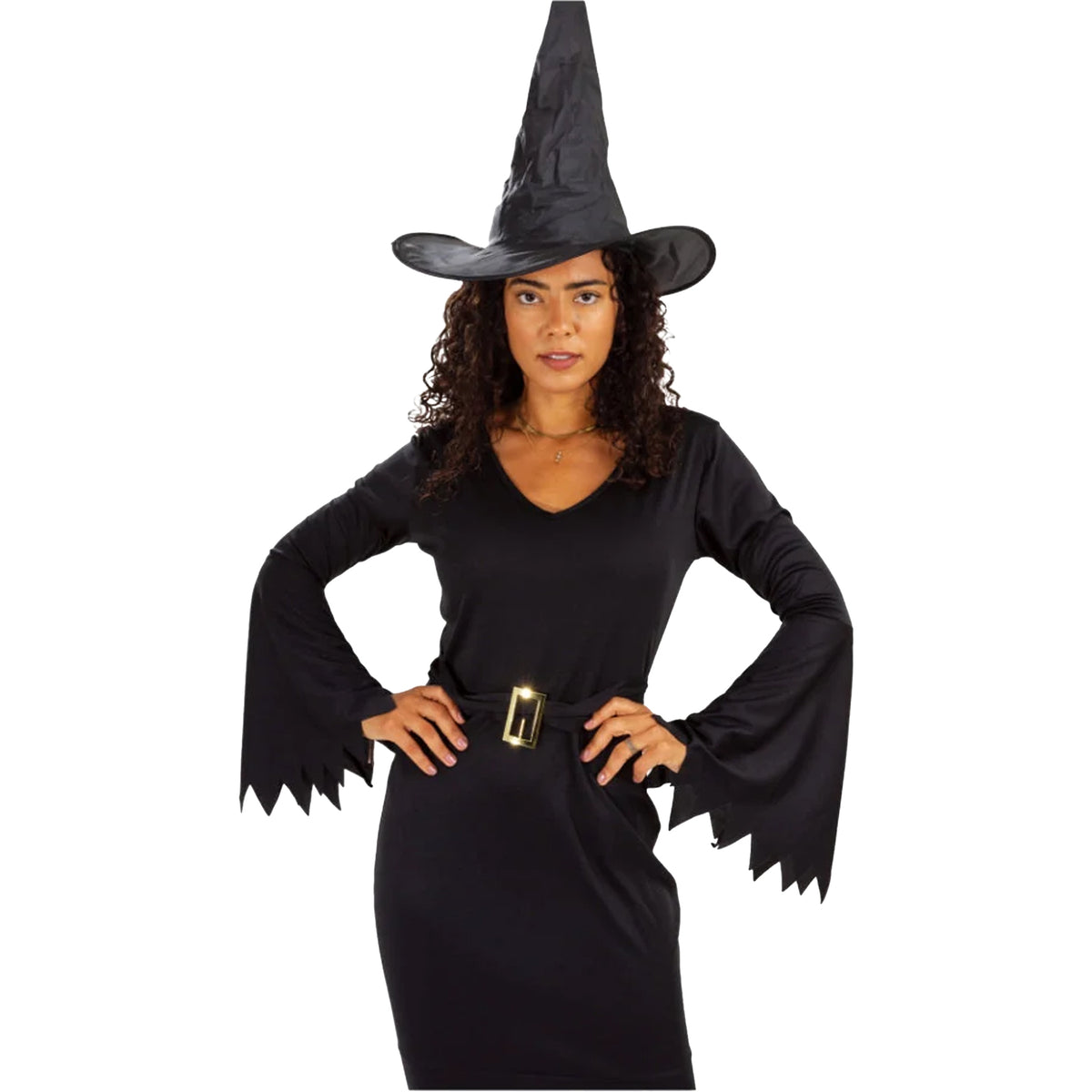 A woman modeling a black witch costume consisting of a pointed black hat, a long-sleeve black dress with scalloped edges, and a black belt with a gold buckle, set against a plain white background.