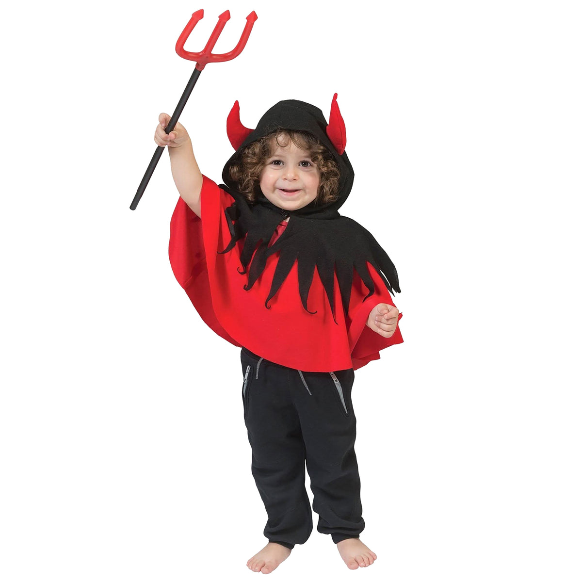Child wearing a red and black devil costume with horns and a pitchfork on a white background