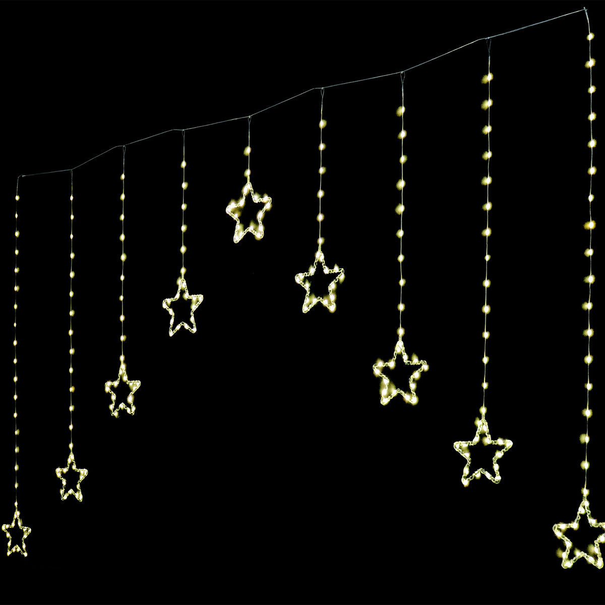 Warm white LED star curtain string lights hanging in a staggered row against a solid black background.