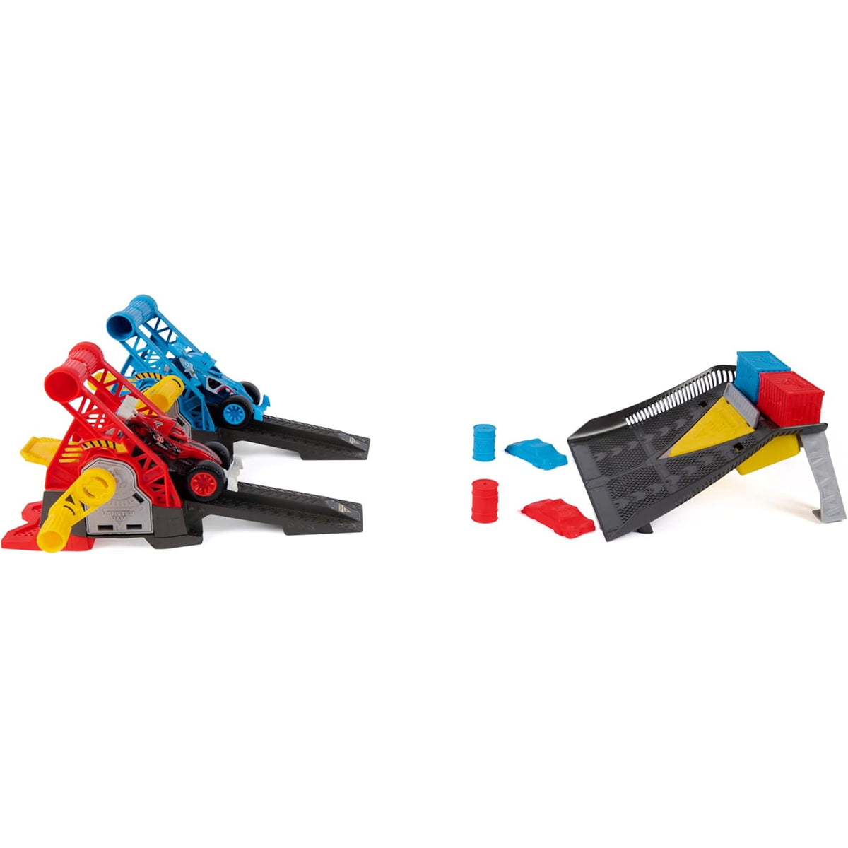 A toy construction set shown on a plain white background, featuring two assembled structures and several loose plastic pieces. The set includes black, gray, blue, red, yellow, and white components arranged as building blocks or ramps.