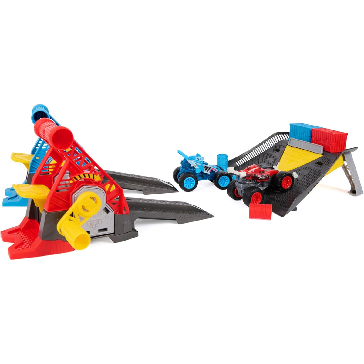 A toy construction vehicle playset featuring a red and blue crane, a black and gray ramp with red and blue cargo boxes, and two small toy vehicles, all shown on a plain white background.